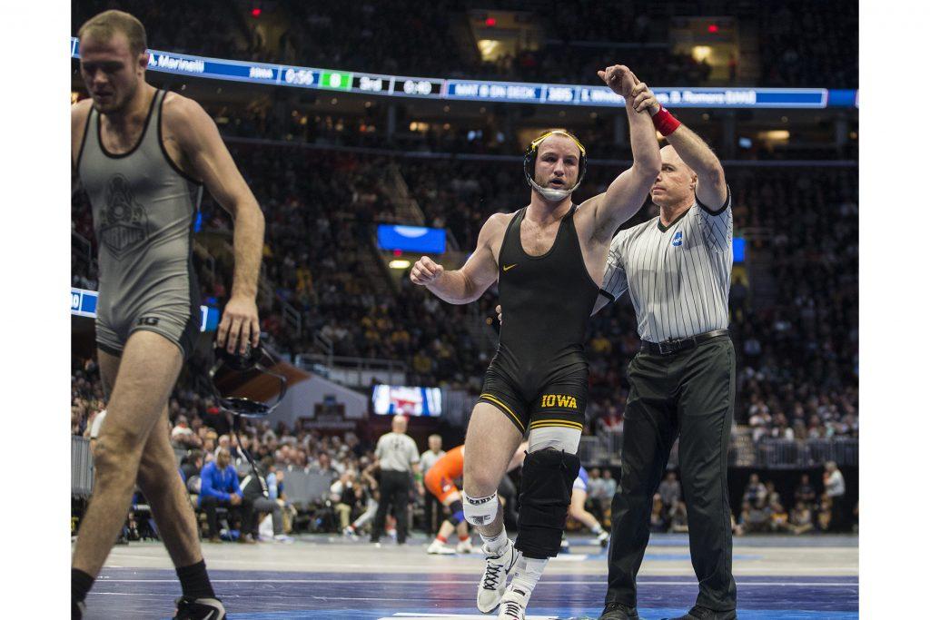 Iowa's 165-pound Alex Marinelli beats Purdue's Jacob Morrissey during Session 1 of the NCAA Division 1 Wrestling Championships at Quicken Loans Arena in Cleveland, Ohio on Thursday, March 15, 2018. Marinelli defeated Morrissey by fall in 6:20. Iowa leads the tournament with 18.5 team points at the end of Session 1. (Ben Allan Smith/The Daily Iowan)