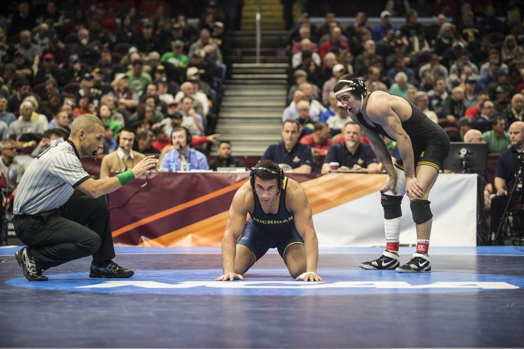 Michigans+Alec+Pantaleo%2C+middle%2C+chooses+the+down+position+against+Iowas+Micheal+Kemerer+in+a+157-pound+bout+during+Session+5+of+the+NCAA+Wrestling+Championships+at+Quicken+Loans+Arena+in+Cleveland%2C+OH+on+Saturday%2C+March+17%2C+2018.+Kemerer+went+on+to+defeat+Pantaleo+by+decision%2C+6-1.+%28Ben+Allan+Smith%2FThe+Daily+Iowan%29