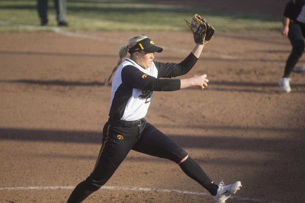 Pitcher senior Kenzie Ihle winds up to throw during Womens Softball Iowa vs. South Dakota State University at Bob Pearl Field on March 21, 2018. The Jackrabbits defeated the Hawkeyes 5 to 2 in the 7th inning. (Katie Goodale/The Daily Iowan)