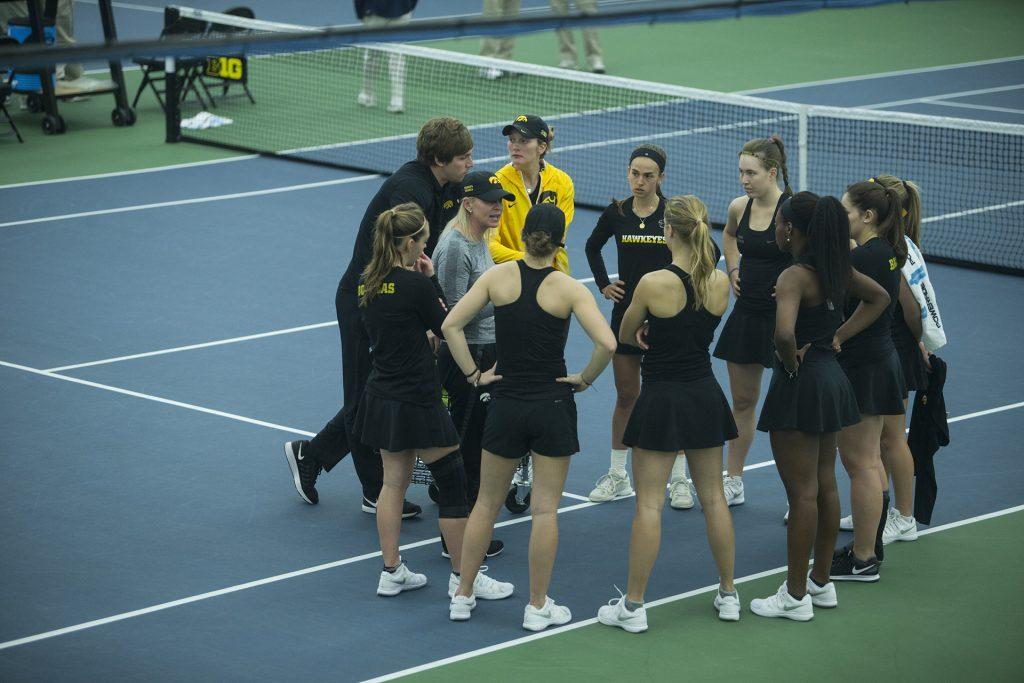 Iowa+players+and+coaches+huddle+before+a+tennis+match+between+Iowa+and+Ohio+State+in+Iowa+City+on+Sunday%2C+March+25%2C+2018.+The+Buckeyes+swept+the+doubles+point+and+won+the+match%2C+6-1.+%28Shivansh+Ahuja%2FThe+Daily+Iowan%29