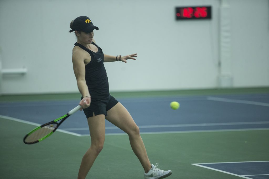 Iowas Elise Van Heuvelen hits a forehand during a tennis match between Iowa and Ohio State in Iowa City on Sunday, March 25, 2018. The Buckeyes swept the doubles point and won the match, 6-1. (Shivansh Ahuja/The Daily Iowan)