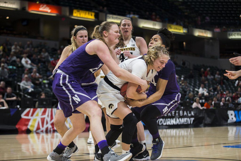 Iowa+guard+Makenzie+Meyer+fights+for+the+ball+from+Northwestern+players+during+the+Iowa%2FNorthwestern+Big+Ten+tournament+basketball+game+at+Bankers+Life+Fieldhouse+in+Indianapolis+on+Thursday%2C+March%2C+1%2C+2018.+The+Hawkeyes+defeated+the+Wildcats%2C+55-45.+Iowa+takes+on+No.4+Minnesota+on+Friday.+%28Lily+Smith%2FThe+Daily+Iowan%29