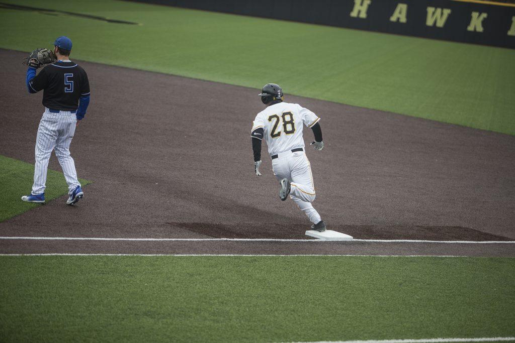Iowa infielder Chris Whelan (28) rounds first during the NCAA mens baseball game between Iowa and Saint Louis at Duane Banks Field on Tuesday, March 20, 2018. (Ben Allan Smith/The Daily Iowan)