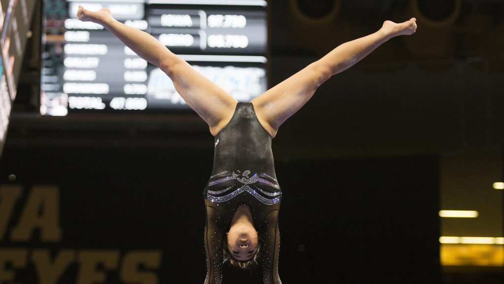 Iowas Nicole Chow performs on the uneven bars during the Iowa/Southeast Missouri State gymnastics meet at Carver-Hawkeye Arena on Friday, Mar. 02, 2018. Chow scored a 9.800. The GymHawks defeated the Redhawks, 195.550-192.750. (Katina Zentz/ The Daily Iowan)