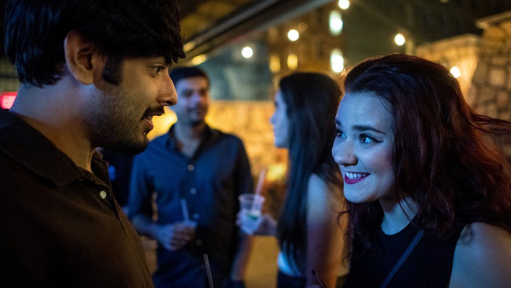 Star Tribune reporter Danielle Fox, right, talks to Akshay Bindra, her first date found on Tinder Social, while grabbing a drink at Sneaky Pete's late Saturday night, Aug. 6, 2016 in downtown Minneapolis.    (Aaron Lavinsky/Minneapolis Star Tribune/TNS)