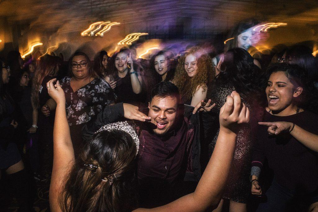 UI Sophomore Mayte Gomez-Cruz dances with the crowd during a mock Quinceañera celebration at the IMU on Thursday, Mar. 22nd, 2018. A Quinceañera is a coming of age ceremony in hispanic communities to mark a womans 15th birthday. (James Year)