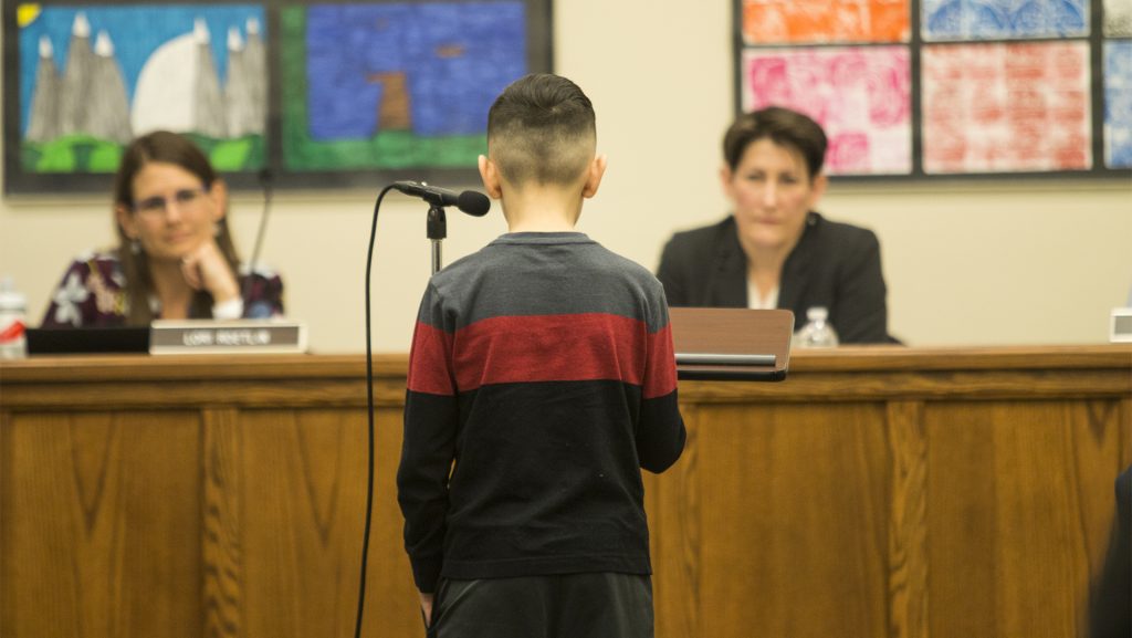 A young attendee talks about his fear of school shootings during the Iowa City school board meeting at the Professional Development Center on March 27, 2018. Members of the school board discussed the possibility of creating a safety task force. (Katina Zentz/The Daily Iowan)