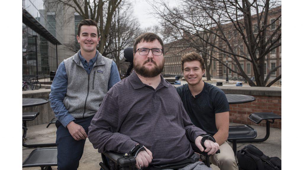 From left: Peter Easler, Michael Penniman, and Jacob Newcomb pose for portraits outside Burge Residence Hall on Thursday, March 22, 2018. Easler, Penniman, Newcomb are UI students starting a nonprofit to assist students with disabilities. It was inspired by, Penniman, a junior at the UI who was paralyzed in 2012 and was receiving inadequate healthcare from professional providers. The idea is to provide payment to UI students who are willing to assist disabled classmates. (Ben Allan Smith/The Daily Iowan)