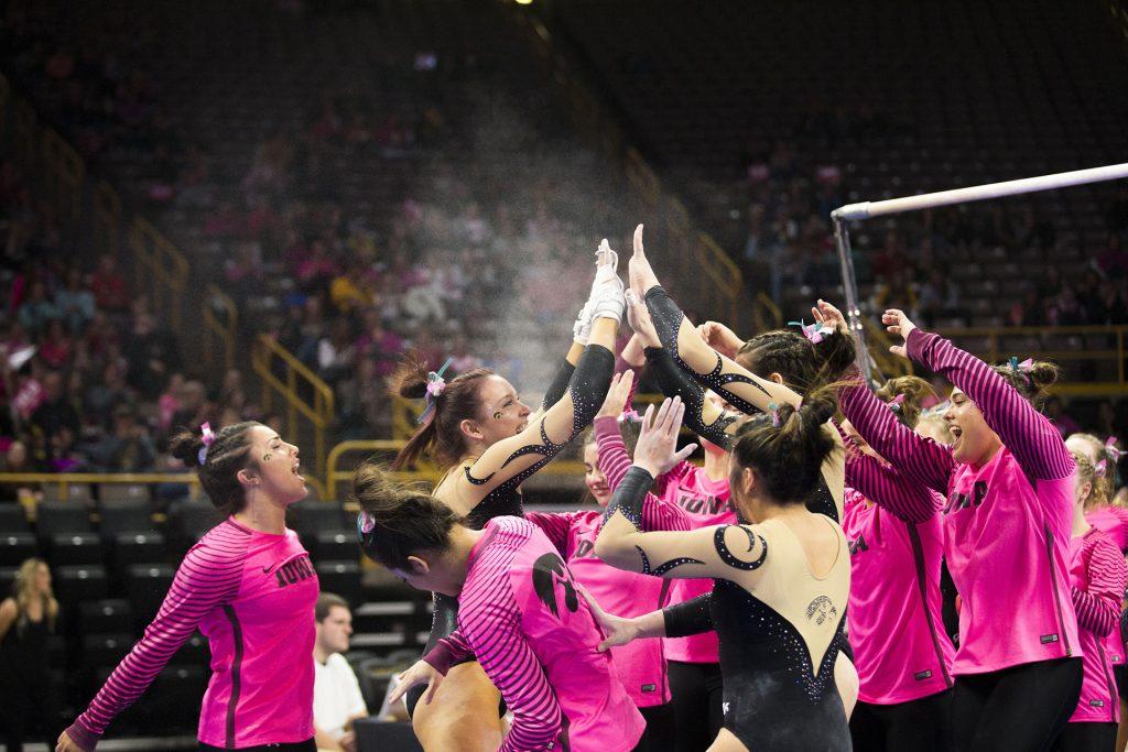 Iowas+Maria+Ortiz+high+fives+teammates+after+performing+on+the+uneven+bars+during+the+Iowa%2FBall+State+gymnastics+meet+at+Carver-Hawkeye+Arena+on+Friday%2C+Feb.+16%2C+2018.+Ortiz+scored+a+9.775.+The+GymHawks+defeated+the+Cardinals%2C+195.775-194.825.+%28Lily+Smith%2FThe+Daily+Iowan%29