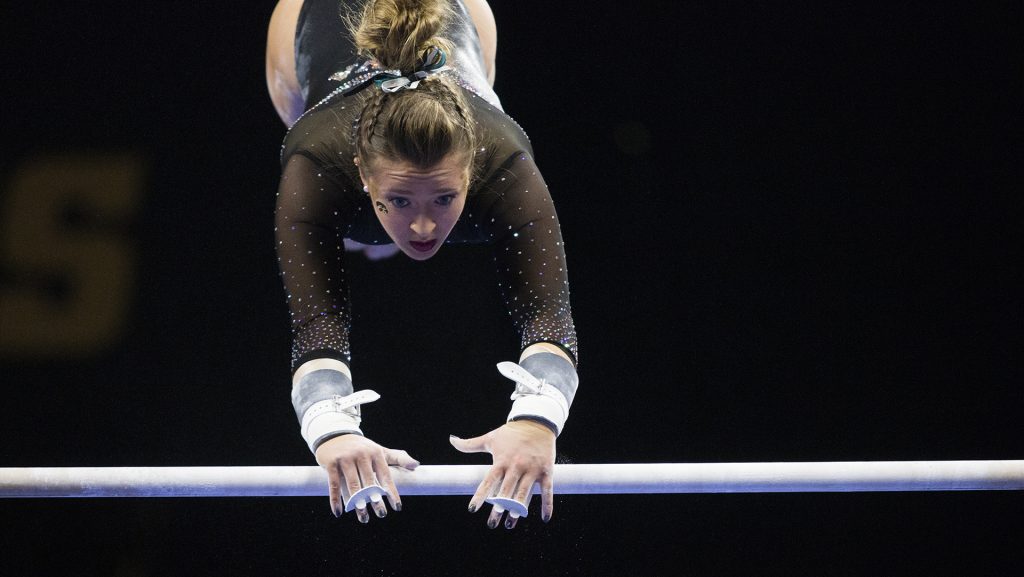 Iowas Maddie Kampshroeder performs on the uneven bars during the Iowa/Southeast Missouri State gymnastics meet at Carver-Hawkeye Arena on Friday, Mar. 02, 2018. Kampshroeder scored a 9.775. The GymHawks defeated the Redhawks, 195.550-192.750. (Katina Zentz/ The Daily Iowan)