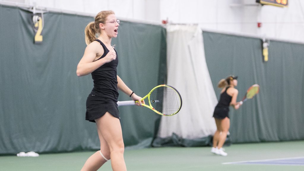 Iowa tennis player Montana Crawford celebrates scoring a point during a match against Marquette University on Sunday, Feb. 25, 2018 at the Hawkeye Tennis Complex. Iowa swept the match and Crawford won her match 6-3, 6-4. (David Harmantas/The Daily Iowan)