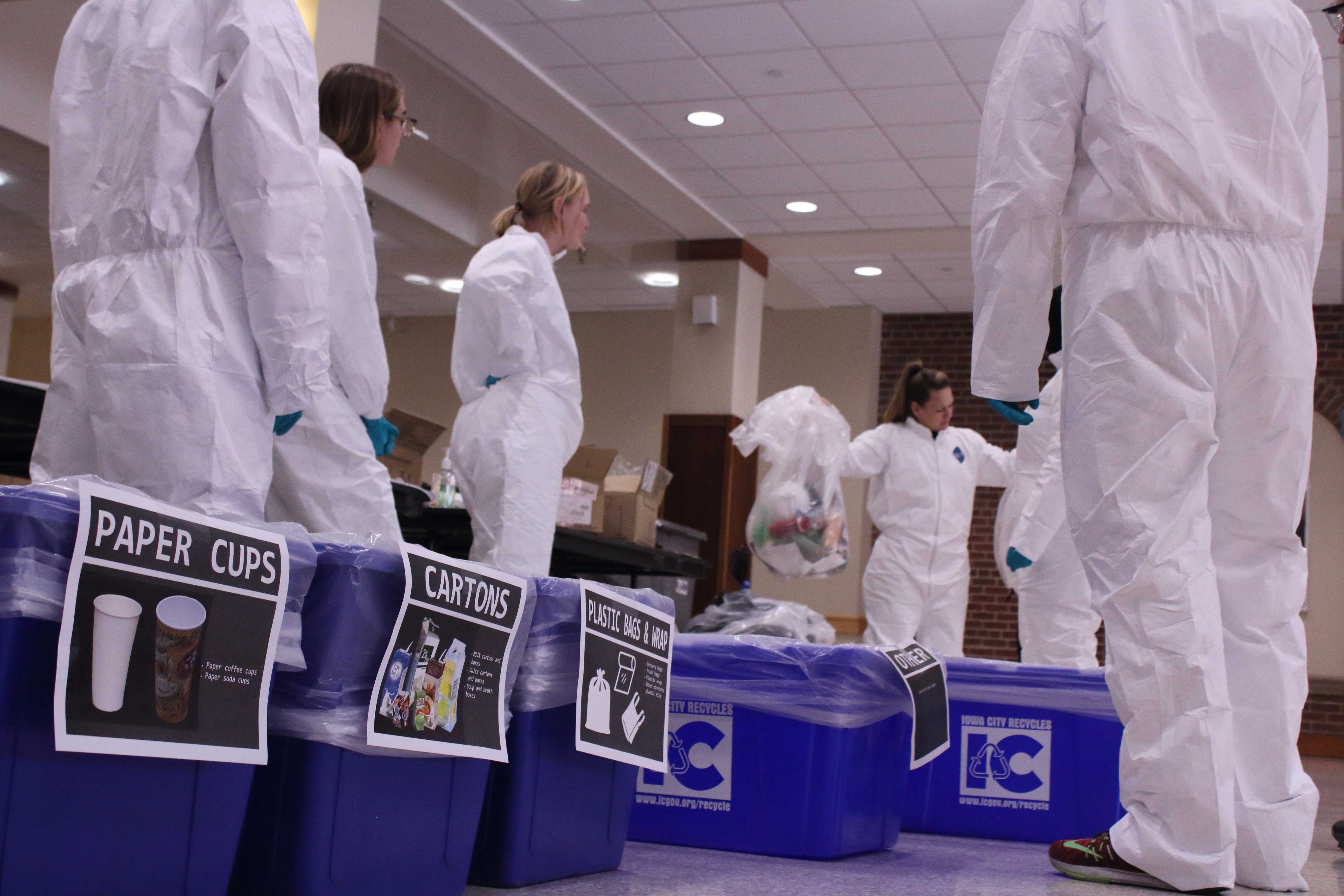 Students participate in a waste audit hosted by the Office of Sustainability in the IMU on Thursday, March 29, 2018. The data collected from the waste audit will be used to create educational campaigns to help the University of Iowa be better at recycling.  (Ashley Morris/The Daily Iowan)