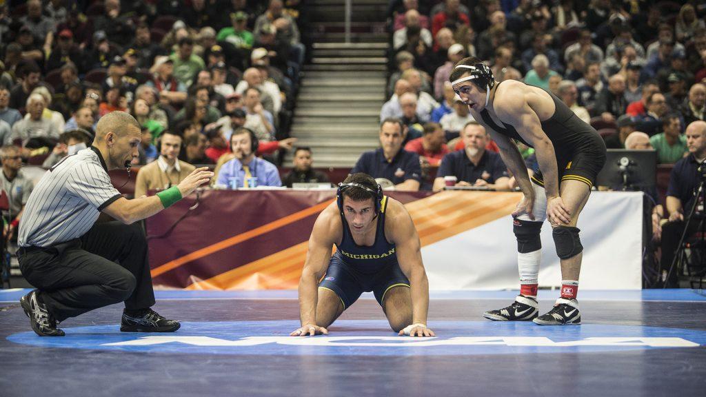 Michigans+Alec+Pantaleo%2C+middle%2C+chooses+the+down+position+against+Iowas+Micheal+Kemerer+in+a+157-pound+bout+during+Session+5+of+the+NCAA+Wrestling+Championships+at+Quicken+Loans+Arena+in+Cleveland%2C+OH+on+Saturday%2C+March+17%2C+2018.+Kemerer+went+on+to+defeat+Pantaleo+by+decision%2C+6-1.+%28Ben+Allan+Smith%2FThe+Daily+Iowan%29