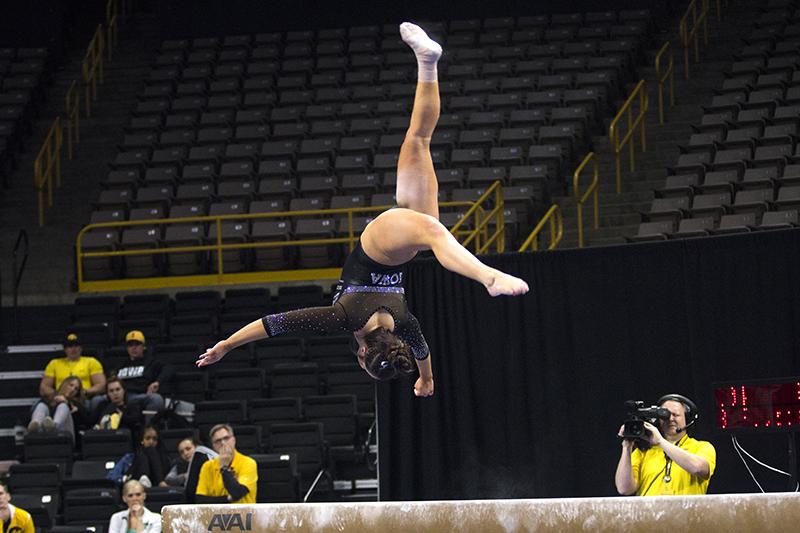 Iowas Nikki Youd performs on the beam during the Iowa/Southeast Missouri State gymnastics meet at Carver-Hawkeye Arena on Friday, Mar. 02, 2018. Youd scored a 9.875. The GymHawks defeated the Redhawks, 195.550-192.750. (Katina Zentz/ The Daily Iowan)