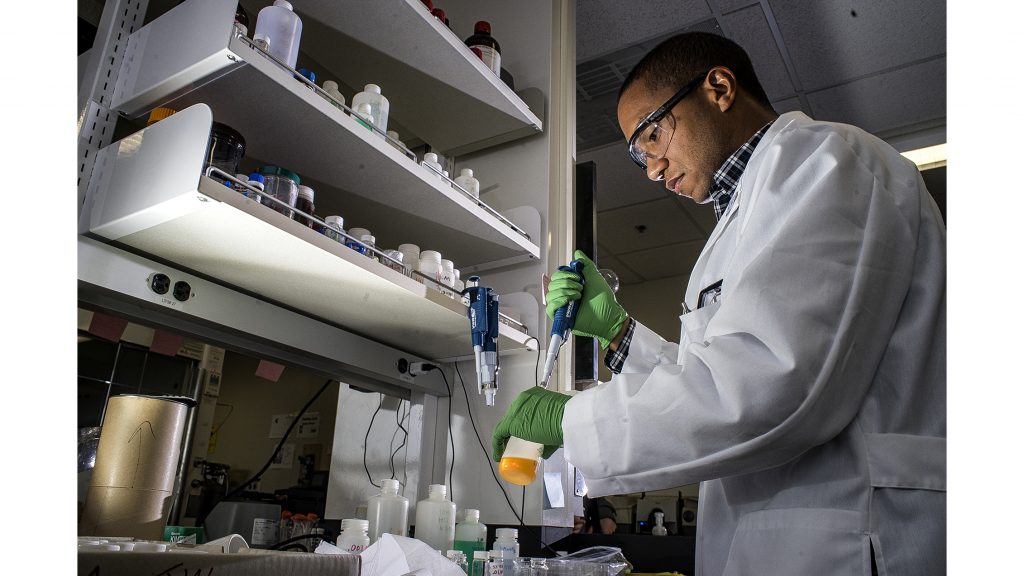 UI grad student, Mo Payne, prepares vials to stimulate uranium crystal growth in his laboratory on Wednesday, March 28, 2018. The research being conducted at the UI is focused on improving nuclear waste storage. (James Year/The Daily Iowan)