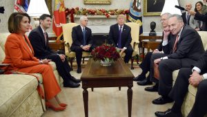 U.S. President Donald Trump and Vice President Mike Pence look on during a meeting with Congressional leadership including House Minority Leader Rep. Nancy Pelosi (D-Calif.), House Speaker Paul Ryan (R-Wis.), Senate Majority Leader Mitch McConnell, and Sen. Charles Schumer (D-NY) in the Oval Office of the White House Thursday, Dec. 7, 2017 in Washington, D.C.  (Olivier Douliery/Abaca Press/TNS)