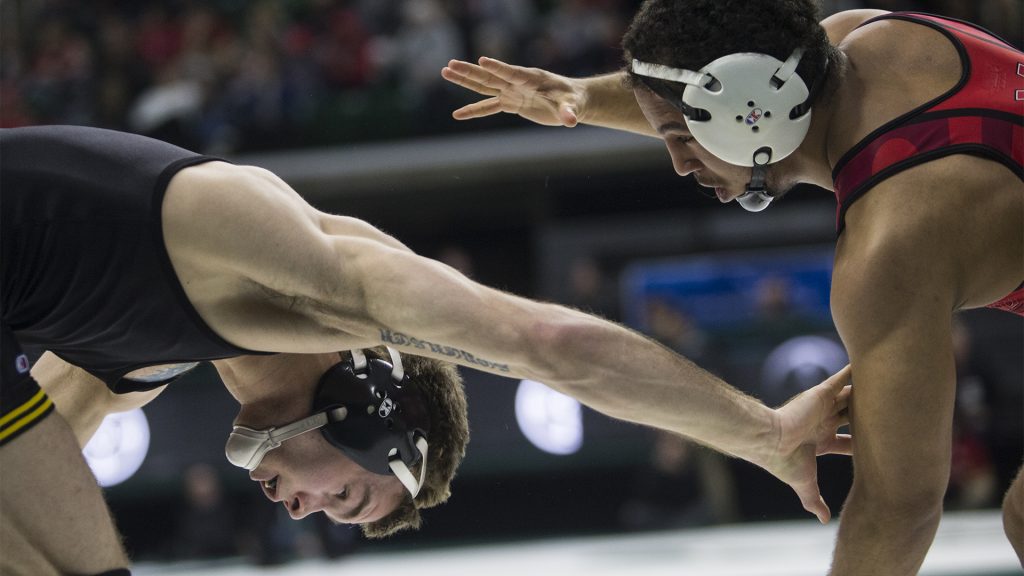 Iowas 149-pound Brandon Sorensen reaches for Marylands Alfred Bannister during Big Ten Wrestling Championships Day 1 at the Breslin Student Events Center in East Lansing, MI on Saturday, Mar. 3, 2018. Sorensen won in a decision, 4-3. (Ben Allan Smith/The Daily Iowan)