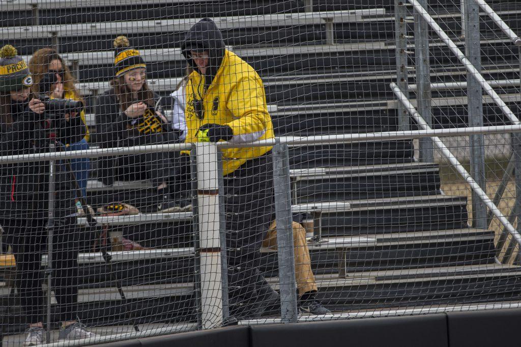 A CSC event staffer dropped a foul ball into a pipe during the Iowa/Wisconsin softball game at Bob Pearl Field  on Sunday, April 8, 2018. The Hawkeyes defeated the Badgers in the third game of the series, 5-3. (Lily Smith/The Daily Iowan)