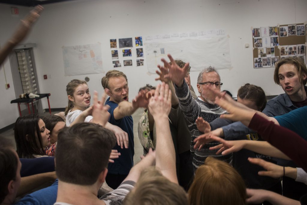 The cast breaks a huddle during an A Midsummer Night's Dream rehearsal in the Old Museum of Art on Tuesday, March 6, 2018.