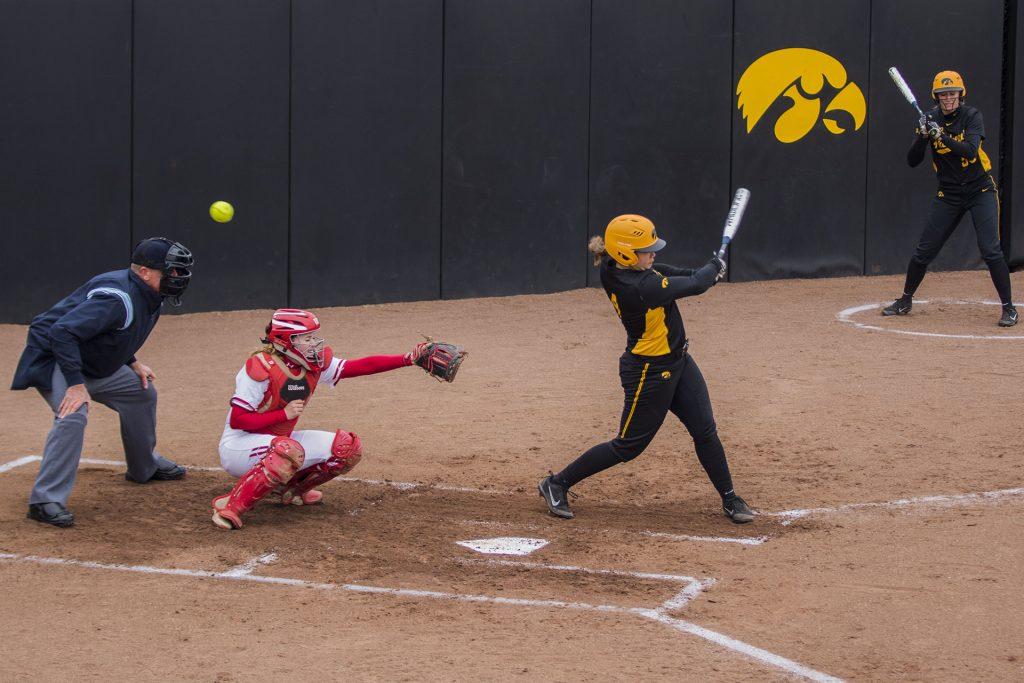 Iowa catcher Taylor Libby bats during the Iowa/Wisconsin softball game at Bob Pearl Field  on Sunday, April 8, 2018. The Hawkeyes defeated the Badgers in the third game of the series, 5-3. (Lily Smith/The Daily Iowan)