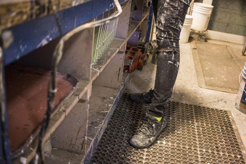 Scenic Painter Rachel Meierotto's legs are seen in the Theatre Building on Thursday, March 29, 2018. (Lily Smith/The Daily Iowan)