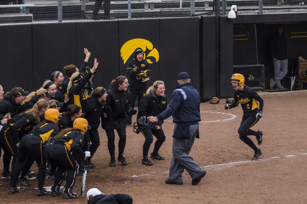 Iowa's Aralee Bogar runs toward home during the Iowa/Wisconsin softball game at Bob Pearl Field  on Sunday, April 8, 2018. The Hawkeyes defeated the Badgers in the third game of the series, 5-3. (Lily Smith/The Daily Iowan)