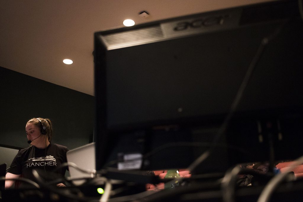 Stage Manager Ellen Kane tests a microphone during an A Midsummer Night's Dream dress rehearsal in the E.C. Mabie theatre in the Theatre Building on Monday, April 16, 2018. (Lily Smith/The Daily Iowan)