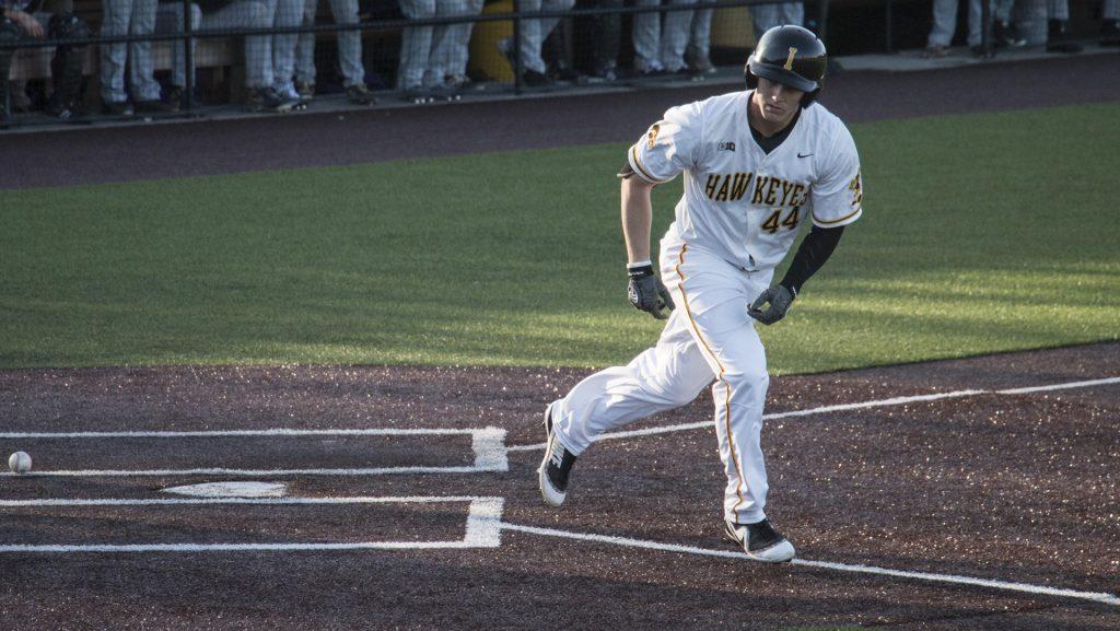 Iowa outfielder Robert Neustrom runs to first after getting a walk during mens baseball Iowa vs. Cornell at Duane Banks Field on Feb. 27, 2018. The Hawkeyes defeated Cornell 15-1. (Katina Zentz/The Daily Iowan)