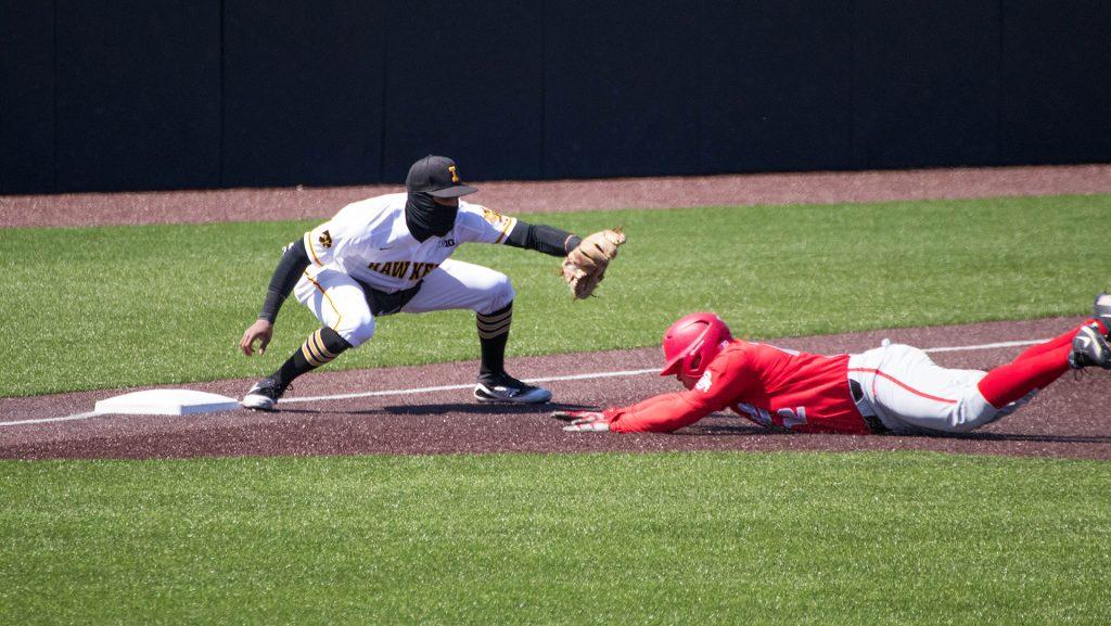 Lorenzo Elion attempts to tag a runner at 3rd base during Iowa baseball vs. Ohio State at Duane Banks Field on April 7, 2018. The Hawkeyes were defeated 2-1. (Megan Nagorzanski/The Daily Iowan)