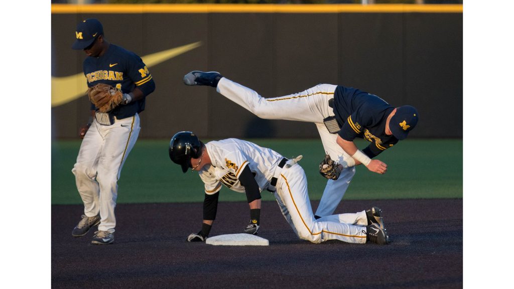 Jack Blomgren tags out the runner during Iowas game against Michigan at Banks Field  on April 27, 2018. The Hawkeyes won the game 4-2. (Megan Nagorzanski/The Daily Iowan)