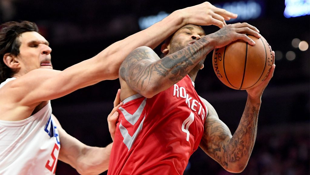 The Houston Rockets' P.J. Tucker (4) is fouled by the Los Angeles Clippers' Boban Marjanovic while grabbing a rebound at the Staples Center in Los Angeles on Wednesday, Feb. 28, 2018. (Wally Skalij/Los Angeles Times/TNS)