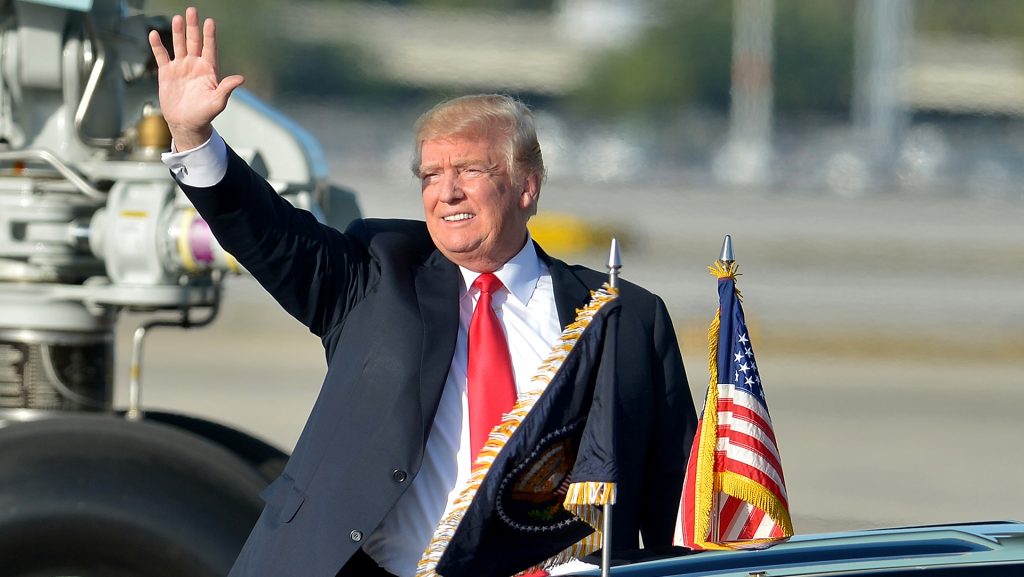 U.S. President Donald Trump waves from Air Force One on Thursday, March 29, 2018 upon arrival in West Palm Beach Airport, Florida. (Johnny Louis/Sipa USA/TNS)