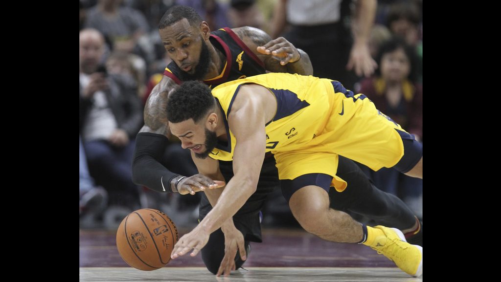 Cleveland Cavaliers' LeBron James and Indiana Pacers' Cory Joseph go after a fourth quarter lose ball in an Eastern Conference first round game on Sunday, April 15, 2018 at Quicken Loans Arena in Cleveland, Ohio. The Cavs lost the game, 98-80. (Phil Masturzo/Akron Beacon Journal/TNS)