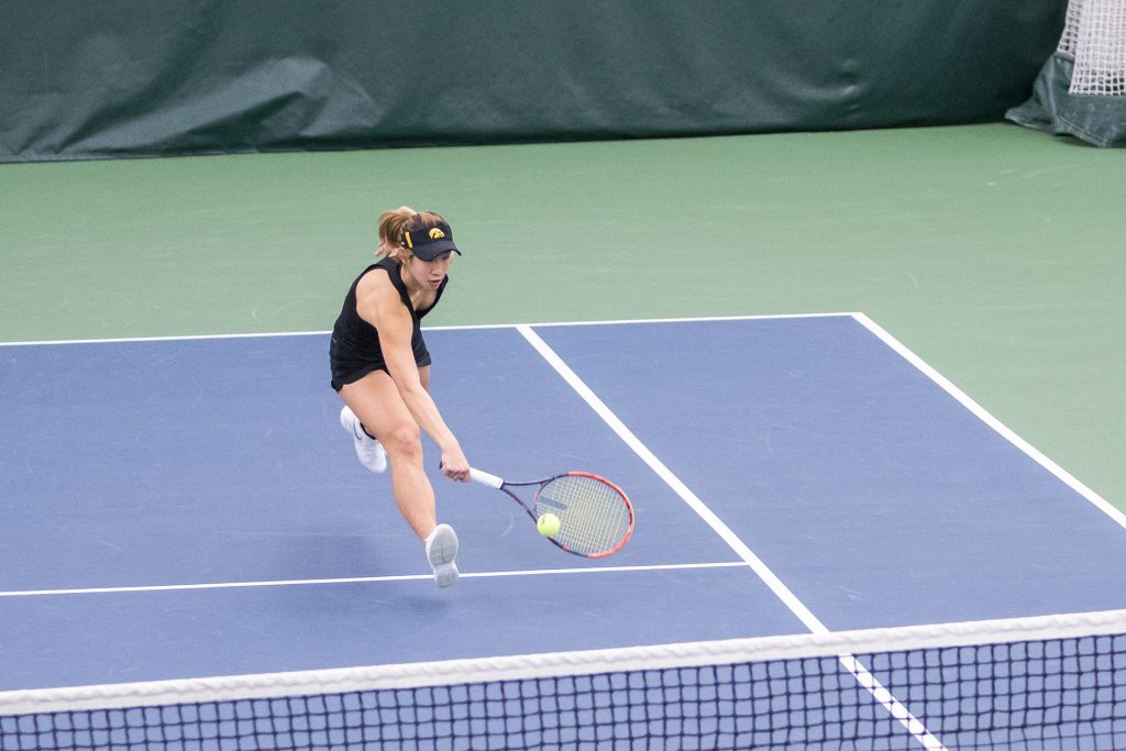 Iowa tennis player Yufei Long lunges for the ball during a match against Marquette University on Sunday, Feb. 25, 2018 at the Hawkeye Tennis Complex. Iowa swept the match and Long won her match 6-1, 6-4. (David Harmantas/The Daily Iowan)