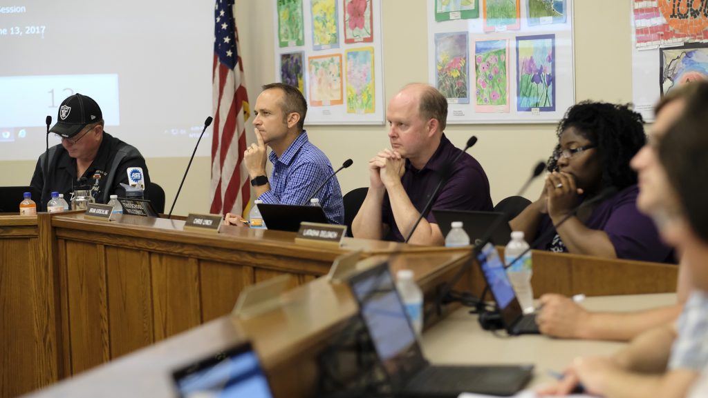 Members of the board listen as a member of the public adresses the Iowa City School Board on Tuesday June 13, 2017. (The Daily Iowan/Nick Rohlman)