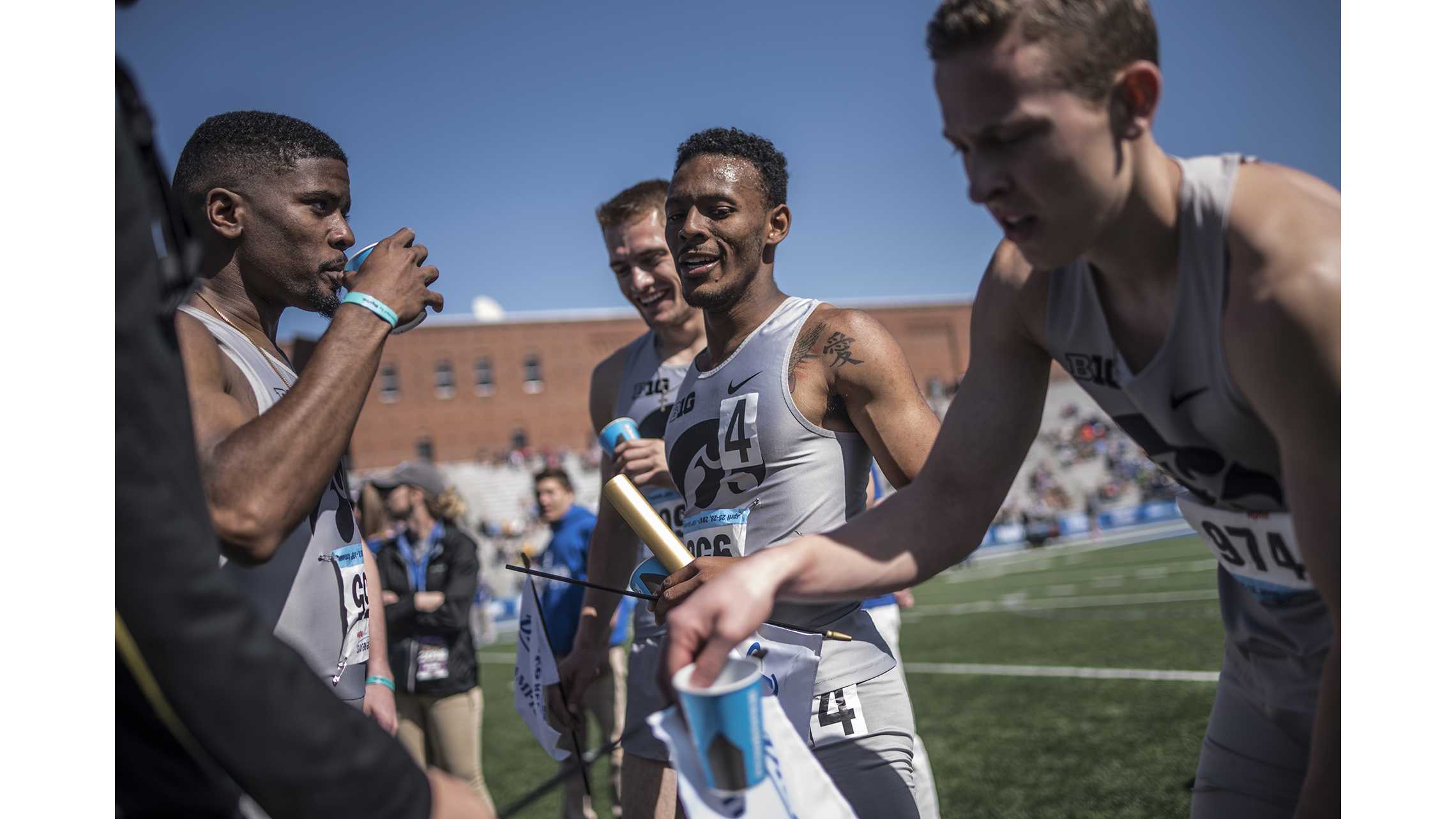 From left: Iowas DeJuan Frye, Collin Hofacker, MarYea Harris, and Chris Thompson rehydrate following their victory in the mens 4x400 meter relay during the 2018 Drake Relays at Drake Stadium in Des Moines, Iowa on Saturday, April 28, 2018.