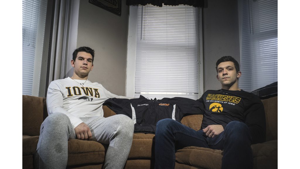 Sebastian (left) and David (right) Jackowski sit inside the living room of Davids house on Linn Street on Monday, April 16. Their brother Kamil died last year at an out-of-state formal for his fraternity. April 30 marks the one-year anniversary of his death. Its not as much gloom and doom anymore as it is looking back on things we can celebrate and be happy about, which is a great feeling to have, David said. (Ben Allan Smith/The Daily Iowan)