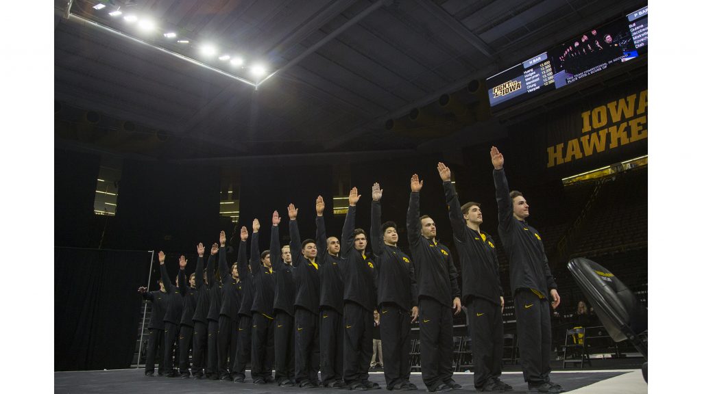 during the Iowa/Illinois mens gymnastics meet at Carver-Hawkeye Arena on Saturday, Feb. 3, 2018. The Fighting Illini defeated the Hawkeyes, 404.700-401.850, to lose their home opener. (Lily Smith/The Daily Iowan)