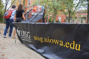 Students shoot hoops on the T. Anne Cleary Walkway on Tuesday, September 26, 2017. UISG hosted tables where students could register to vote. 