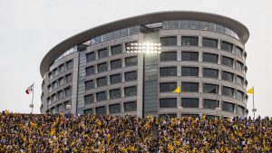 Iowa fans wave to kids in the Stead Family Childrens Hospital during an NCAA football game between Iowa and Wyoming in Kinnick Stadium on Saturday, Sept. 2, 2017.