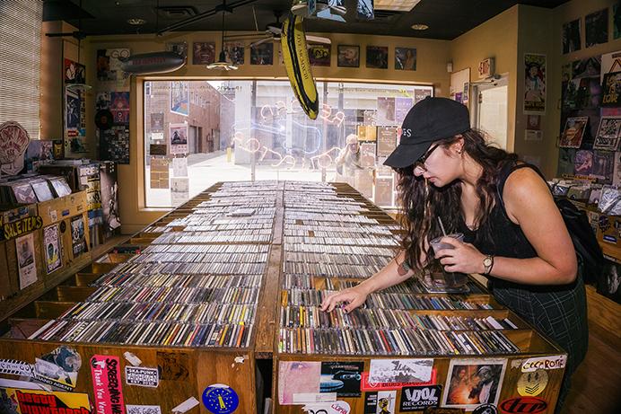 Iowa City resident, Emma Garwood, searches for some new CDs at the Record Collector on Tuesday, July 11, 2017. Emma has been listening to a lot of sludge metal recently and was hoping to find something new to listen to. (James Year/The Daily Iowan)