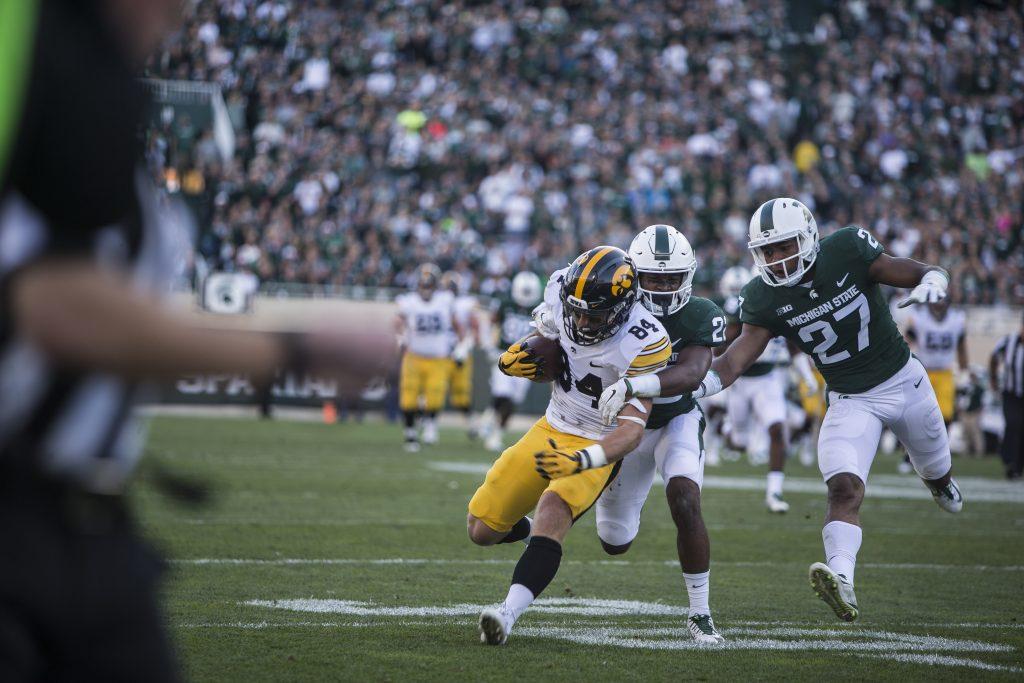 Iowa+wide+receiver+Nick+Easley+is+tackled+by+players+on+the+Michigan+State+defense+during+the+game+between+Iowa+and+Michigan+State+at+Spartan+Stadium+on+Saturday%2C+Sept.+30%2C+2017.+The+Hawkeyes+fell+to+the+Spartans+with+a+final+score+of+10-17.+%28Ben+Smith%2FThe+Daily+Iowan%29
