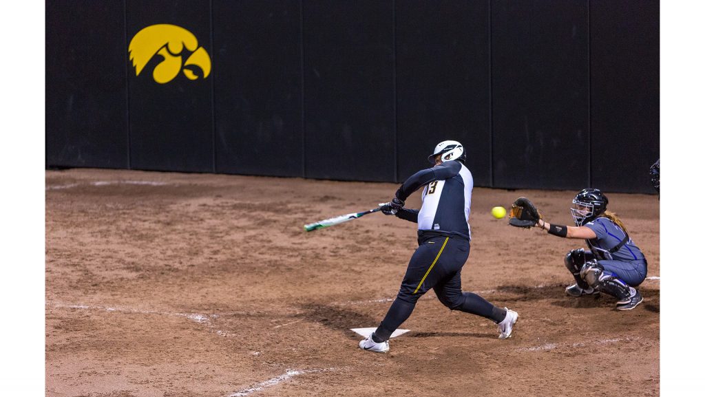 University of Iowa softball player Devin Cantu tries to check her swing during a game against Western Illinois University on Tuesday, Apr. 17, 2018. The Fighting Leathernecks defeated the Hawkeyes 2-1. (David Harmantas/The Daily Iowan)