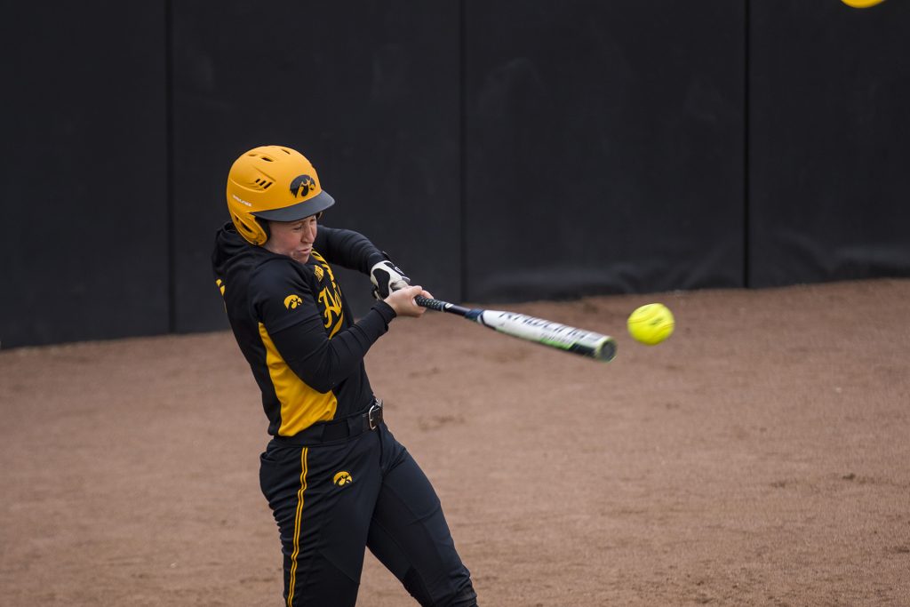 Iowas Mallory Kilian hits a ball during the Iowa/Wisconsin softball game at Bob Pearl Field  on Sunday, April 8, 2018. The Hawkeyes defeated the Badgers in the third game of the series, 5-3. (Lily Smith/The Daily Iowan)