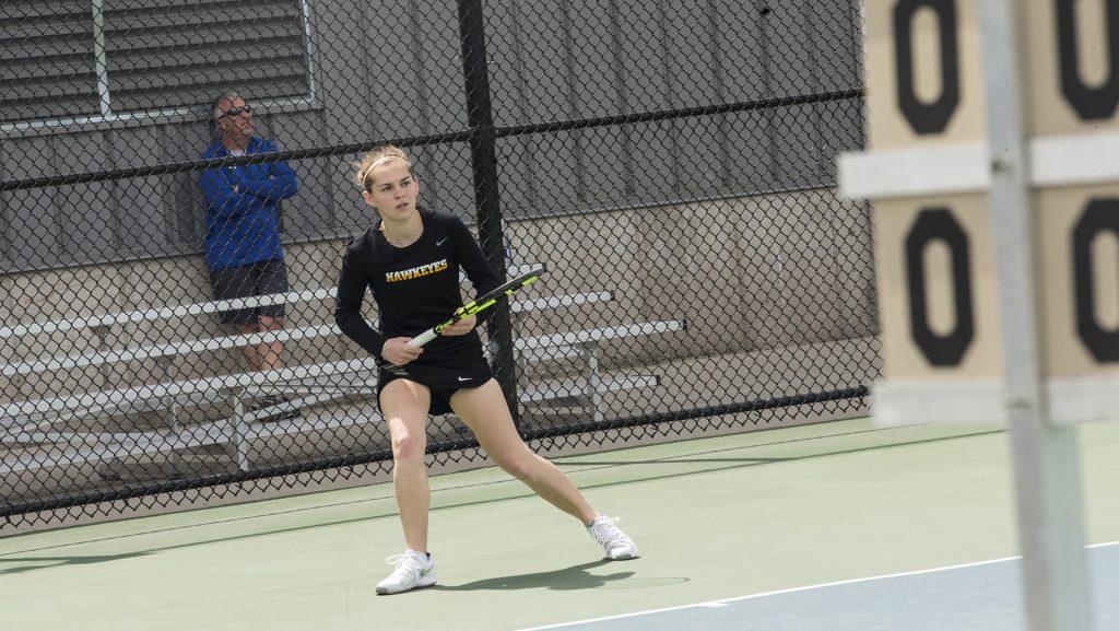 Iowa’s Zoe Douglas waits to return the ball during the women’s tennis match between Iowa and Wisconsin at the Klotz Tennis Courts on Sunday, April 22, 2018. The Hawkeyes lost to the Badgers, 4-1. (Chris Kalous/The Daily Iowan)