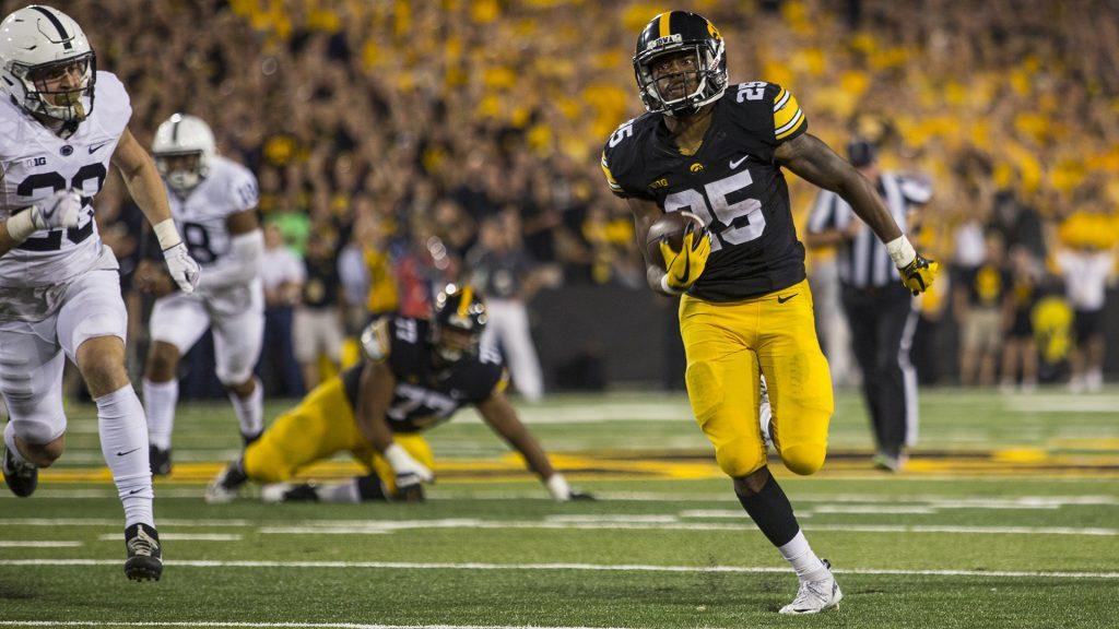 Iowa+running+back+Akrum+Wadley+breaks+free+for+a+touchdown+run+during+Iowas+game+against+Penn+State+at+Kinnick+Stadium+on+Sept.+23%2C+2017.+Penn+State+defeated+Iowa+21-19+on+a+last+second+touchdown+past.+%28Nick+Rohlman%2FThe+Daily+Iowan%29
