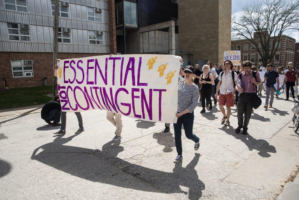 Protesters march from the Pentacrest to the home of UI president Bruce Harreld on May 4, 2018. UI's non-tenured faculty—grown to 52% since 2011—advocated for greater job security, fair pay, and benefits. 