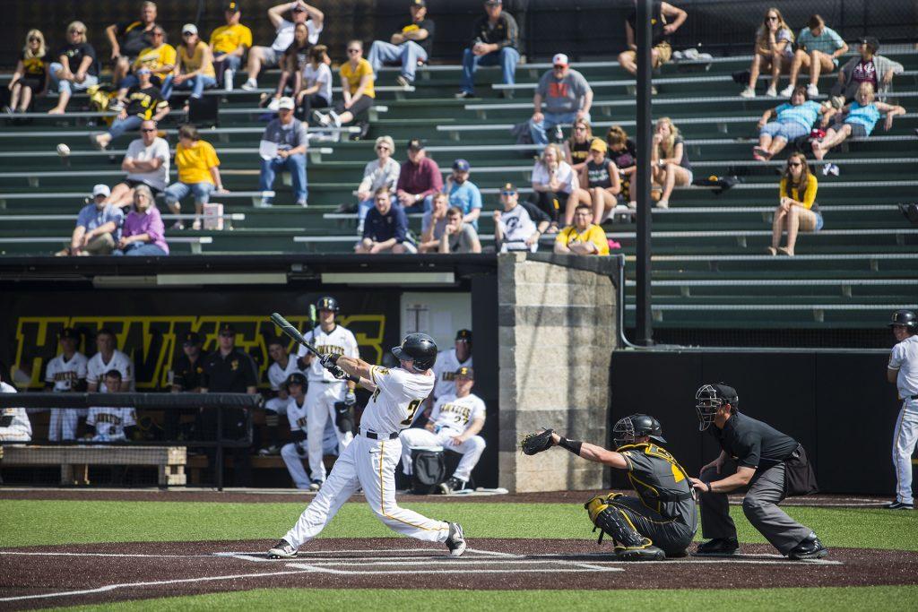 Iowa catcher Austin Guzzo bats during the Iowa/Mizzou baseball game at Duane Banks Field on Tuesday, May 1, 2018. The Tigers defeated the Hawkeyes, 17-16, with two extra innings. (Lily Smith/The Daily Iowan)