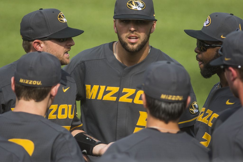 Mizzou players congregate outside the dugout during the Iowa/Mizzou baseball game at Duane Banks Field on Tuesday, May 1, 2018. The Tigers defeated the Hawkeyes, 17-16, with two extra innings. (Lily Smith/The Daily Iowan)