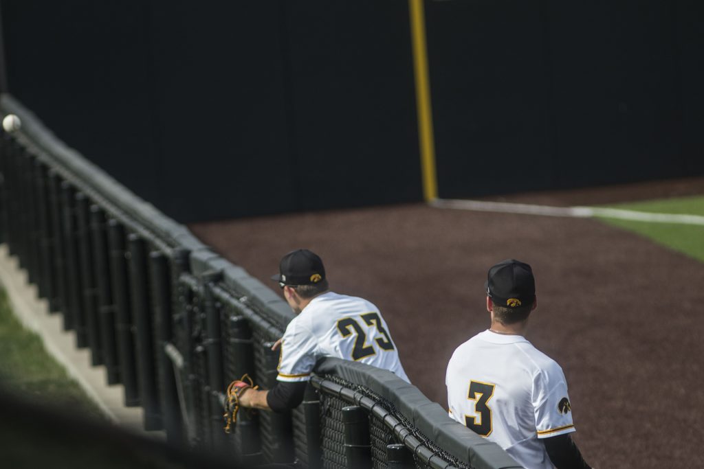 Iowa infielder Kyle Crowl (23) attempts to catch a foul ball during the Iowa/Mizzou baseball game at Duane Banks Field on Tuesday, May 1, 2018. The Tigers defeated the Hawkeyes, 17-16, with two extra innings. (Lily Smith/The Daily Iowan)